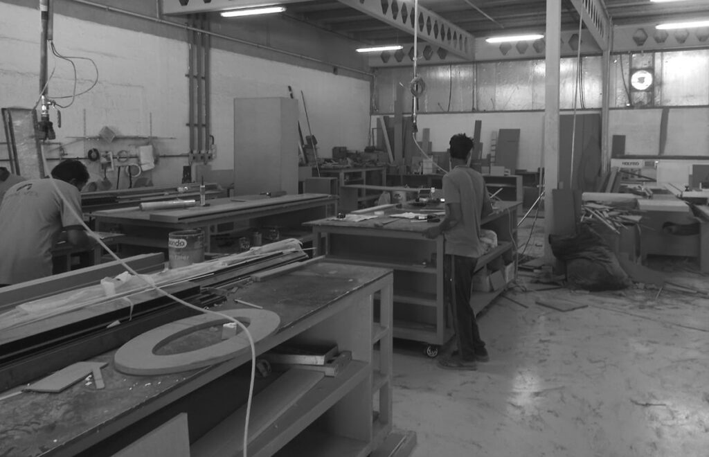 An image of a carpentry workshop with various tools and equipment