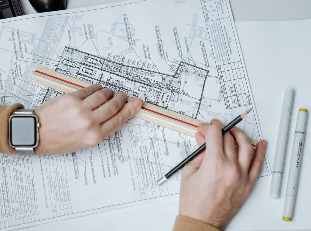 An image of an interior designer drafting a design plan