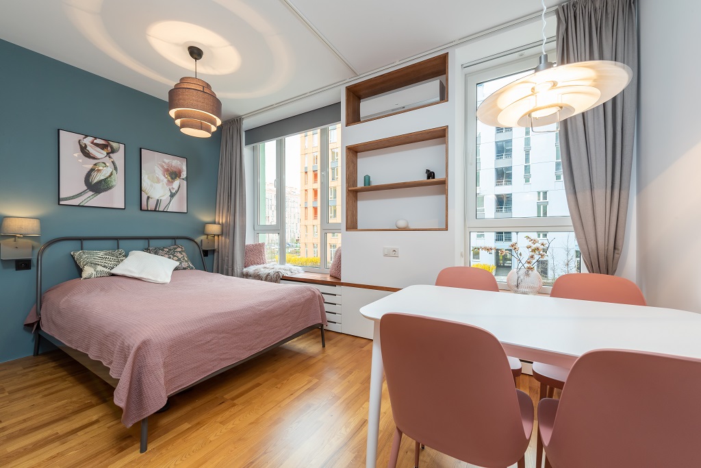 A cozy bedroom with earth-tone colors and well-placed furniture