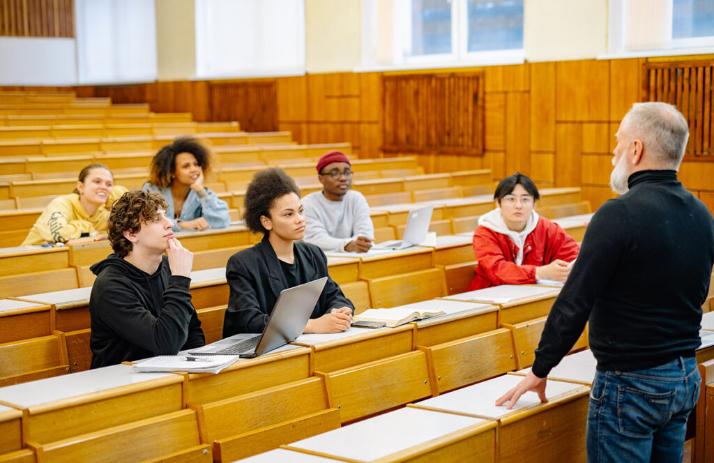 a classroom with a professor explaining design principles to students