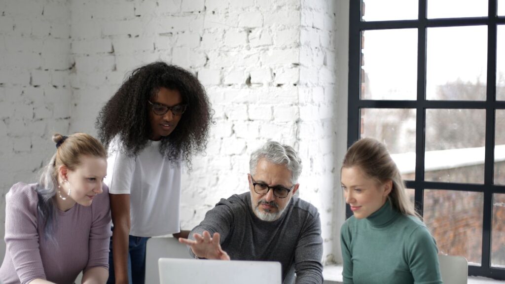 An interior designer discussing a project with their team