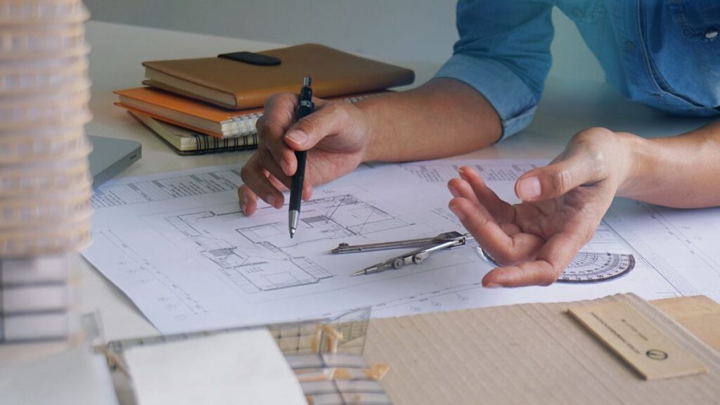 a professional at work, drafting a commercial interior design plan