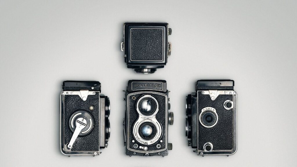 collection of vintage cameras displayed as decorative objects